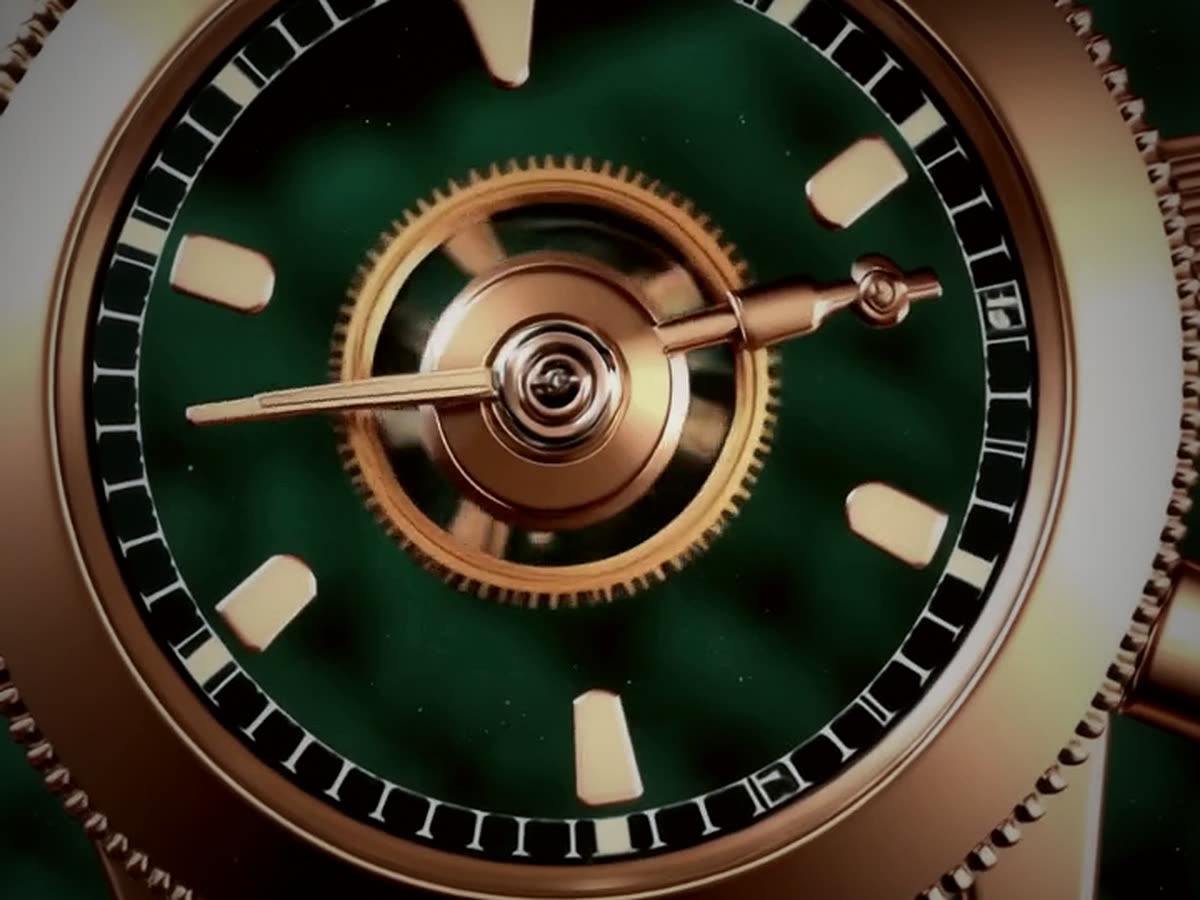 Detail of the rose gold case and green dial of a mechanical watch